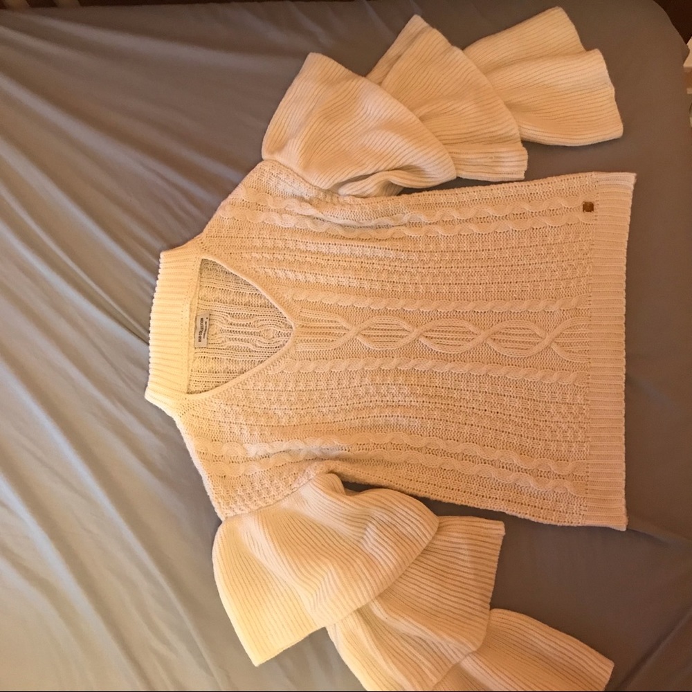 knit white sweater with tiered sleeves and keyhole cutout